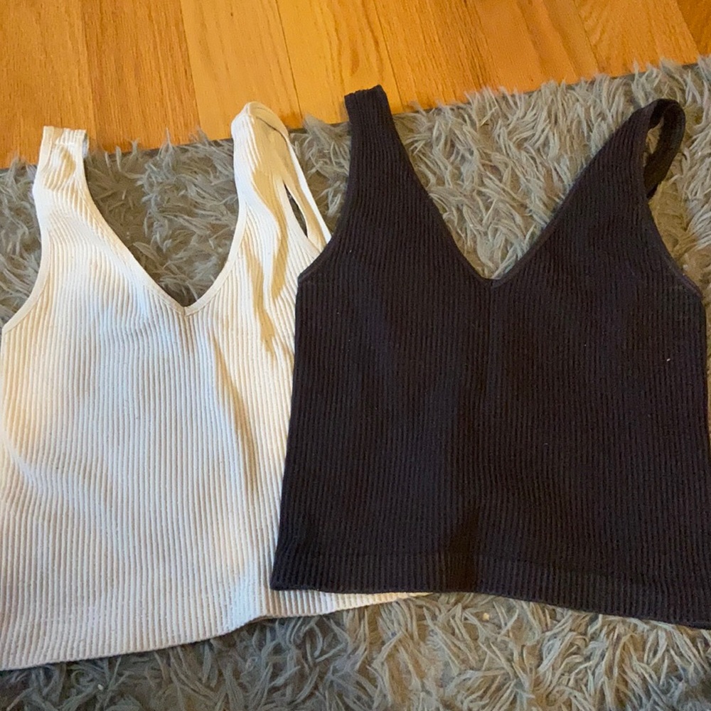two black and white tank tops